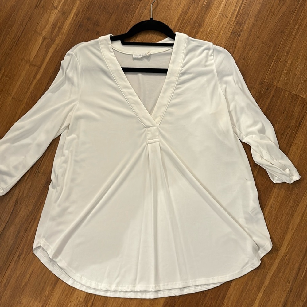 Lush white blouse with button sleeve detail